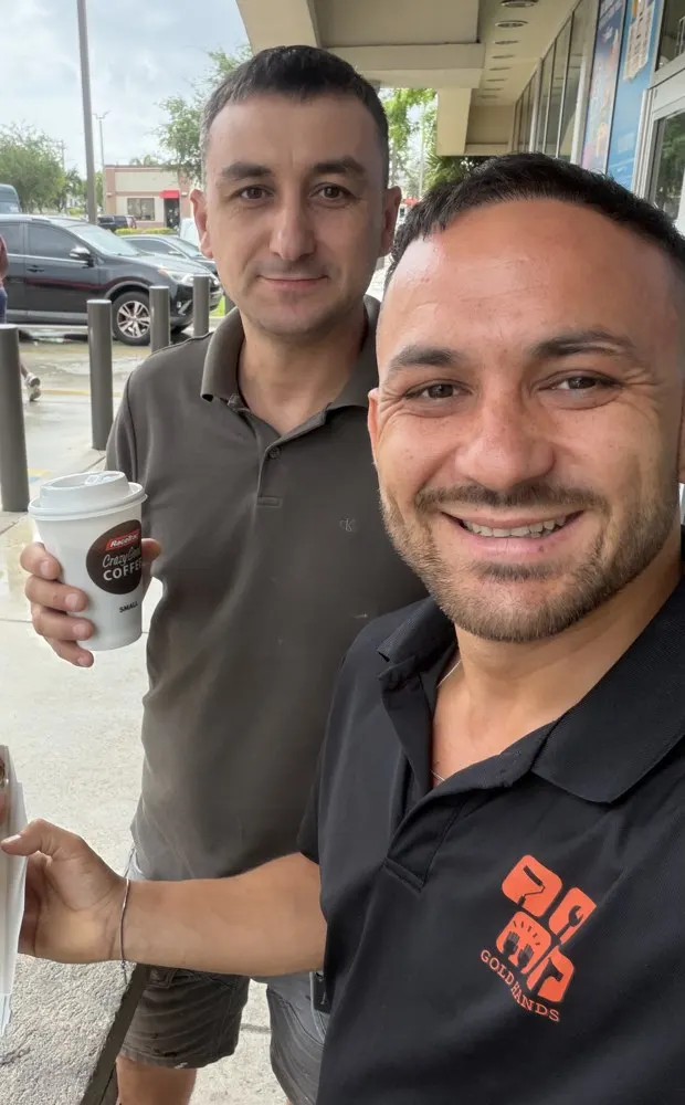 Farrukh Rakhimov, founder of Gold Hands, with technician Slava in Miami