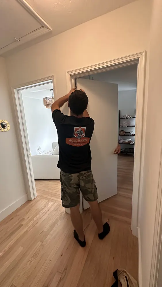 Gold Hands technician fitting an interior door