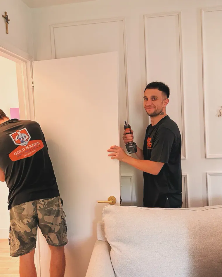 Technician hanging an interior door