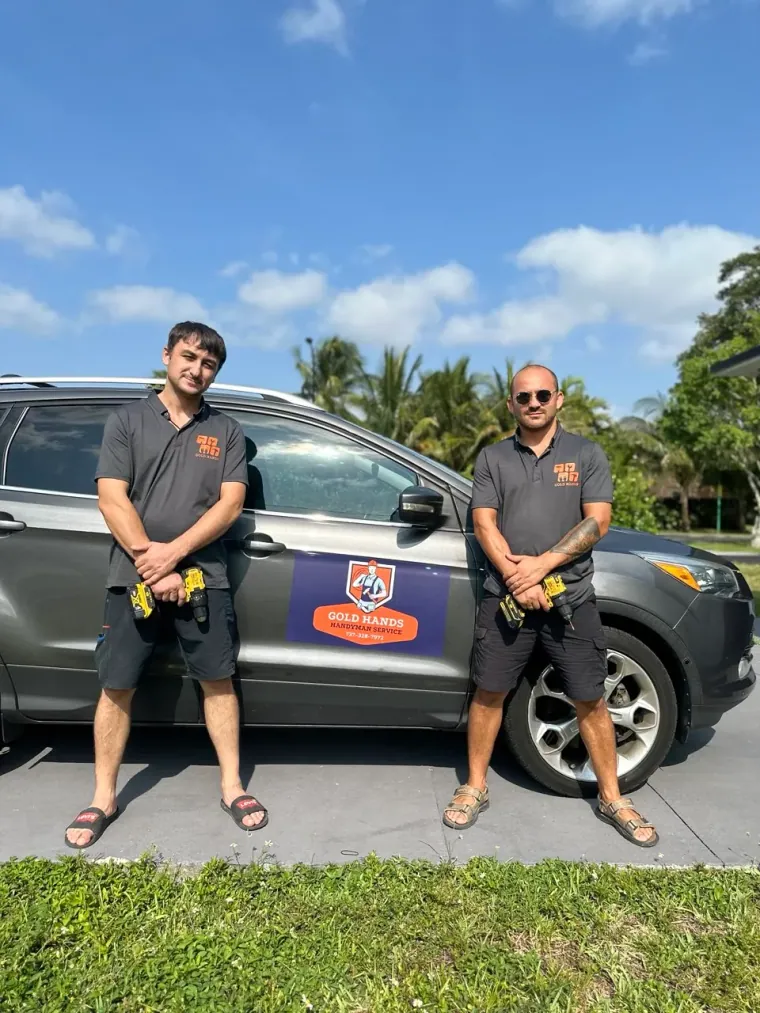 Gold Hands team with the company car