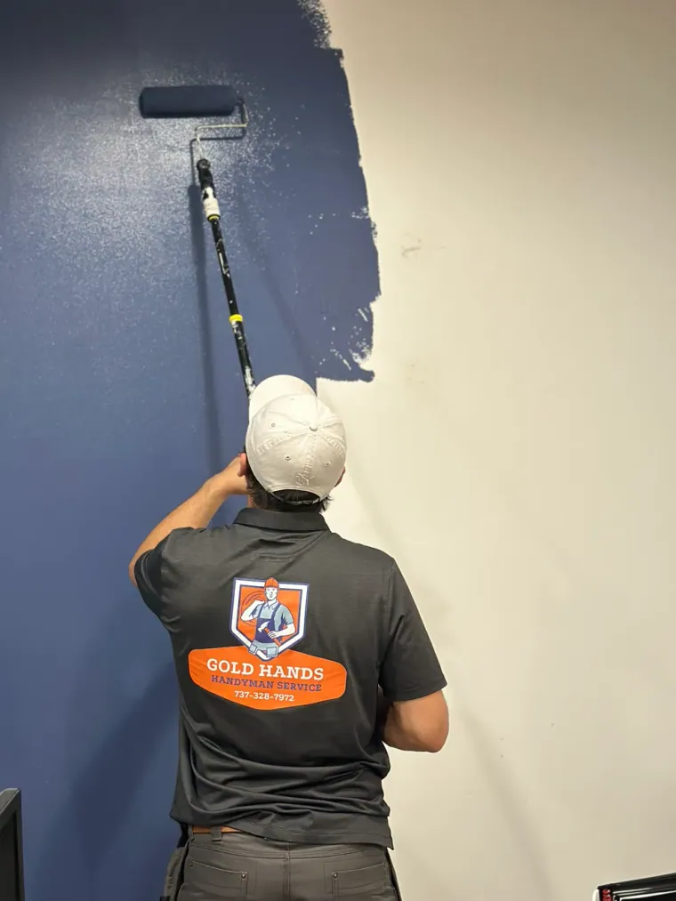 Painting a wall with a roller